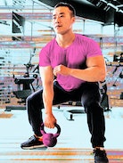 A man wearing a pink shirt using a dumbbells' at the gym while incorporating HIIT for beginners