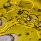 Drops of water form abstract bubbles in olive oil. Photographer: Angel Garcia/Bloomberg.