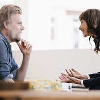 Man and woman having a calm, engaged discussion