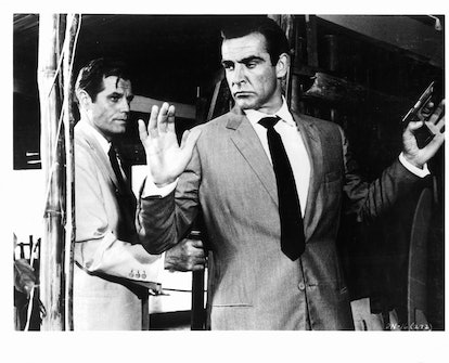 Sean Connery held at gunpoint by Jack Lord in a scene from the film 'James Bond: Dr. No', 1962. (Pho...