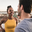A woman flirting with a divorced man on a rooftop.