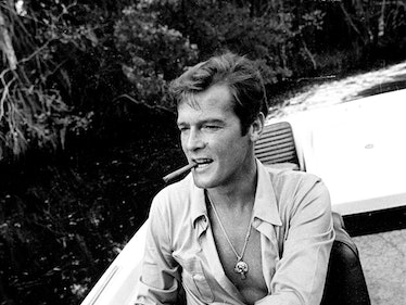 KINGSTON, JAMAICA - MARCH 01:  Roger Moore takes a break during filming of the James Bond film 'Live...