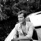 KINGSTON, JAMAICA - MARCH 01:  Roger Moore takes a break during filming of the James Bond film 'Live...