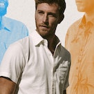 A man wearing a white Short-Sleeve Button-Down Shirt